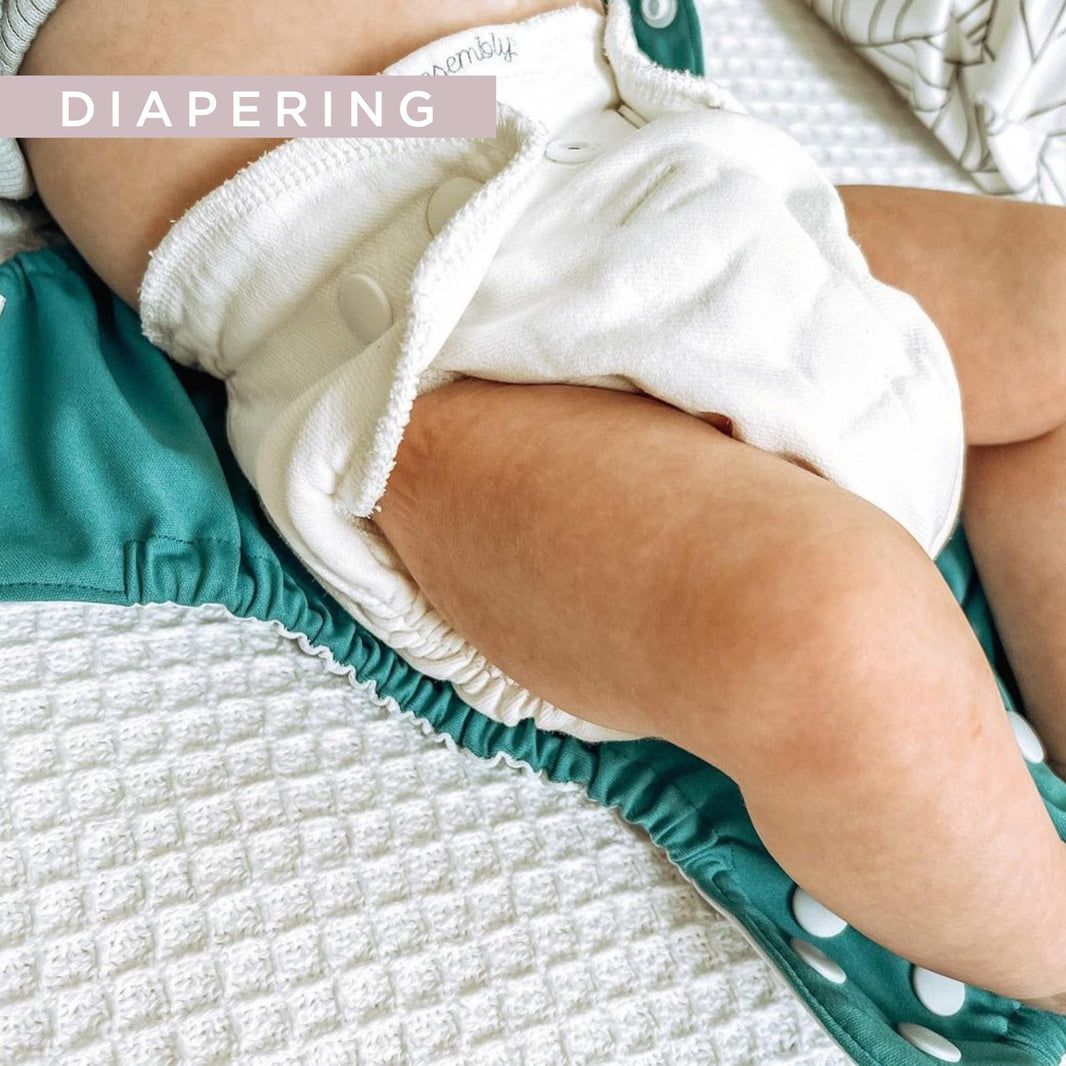 newborn baby in esembly cloth diaper