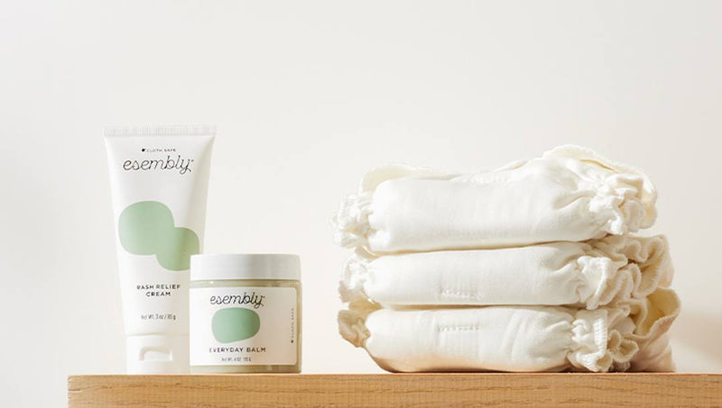 Shelf with tube of Rash Relief Cream, jar of Everyday Balm, and 3 white cotton Inners