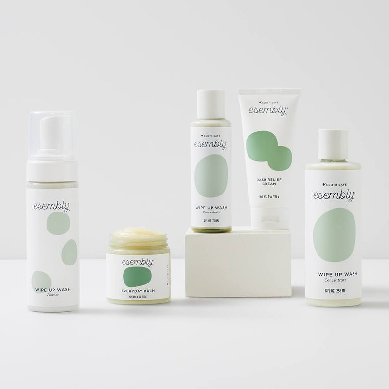 Wipe Up Wash in 4-ounce and 8-ounce, its Foamer, next to Everyday Balm and Rash Relief Cream