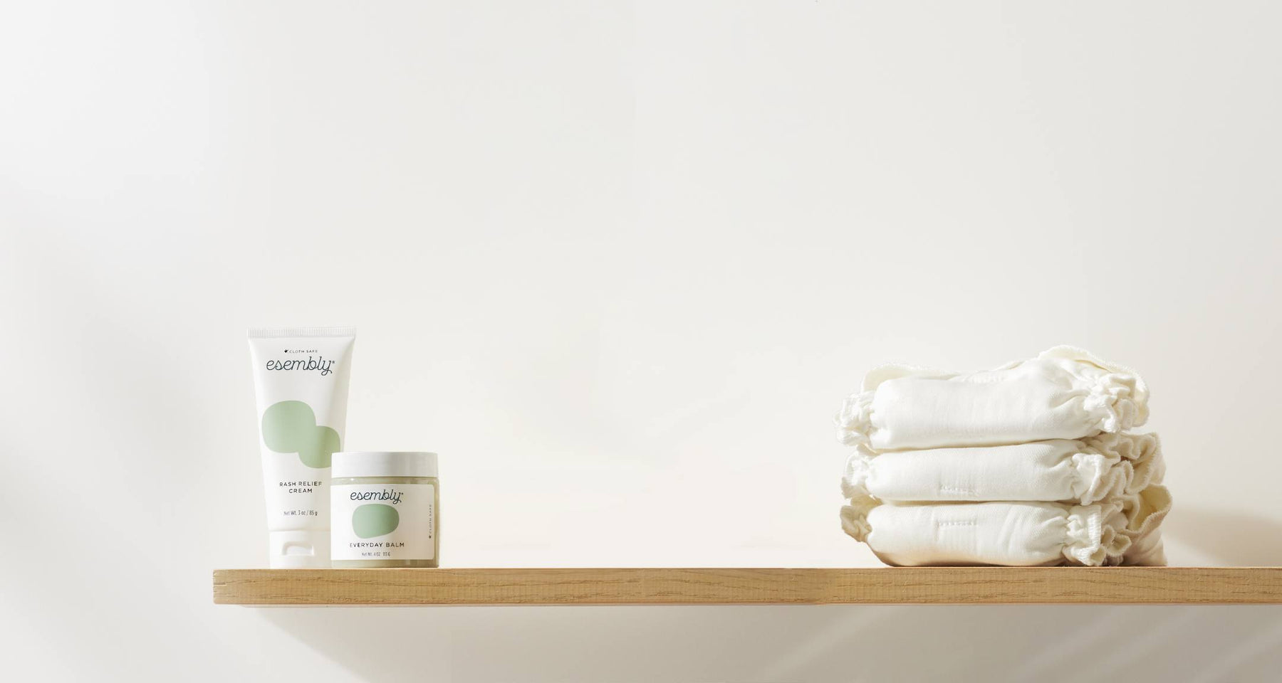 Shelf with tube of Rash Relief Cream, jar of Everyday Balm, and 3 white cotton Inners