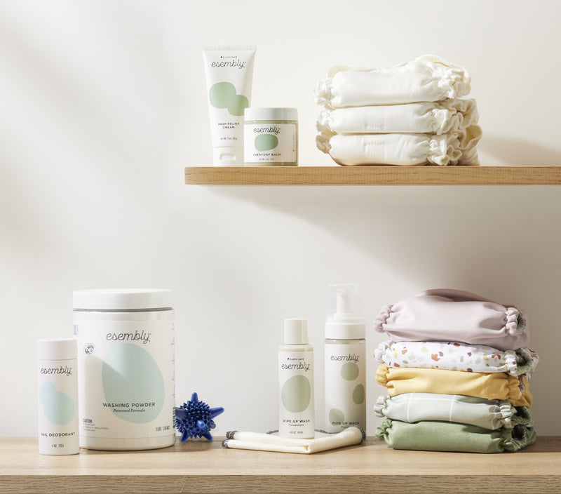 Two shelves filled with Esembly Outers, Inners, Washing Powder, Pail Deodorant, agitators, Wipe Up Wash and Wipe Ups, and Skincare products