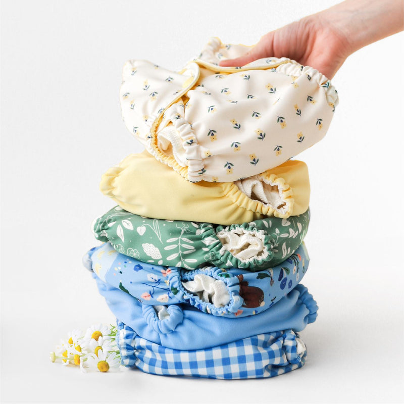 Esembly Outers in Gingham, Cornflower, Bunnies, Aloe, Blush, Buds, Buttercup, and Botany in a stack
