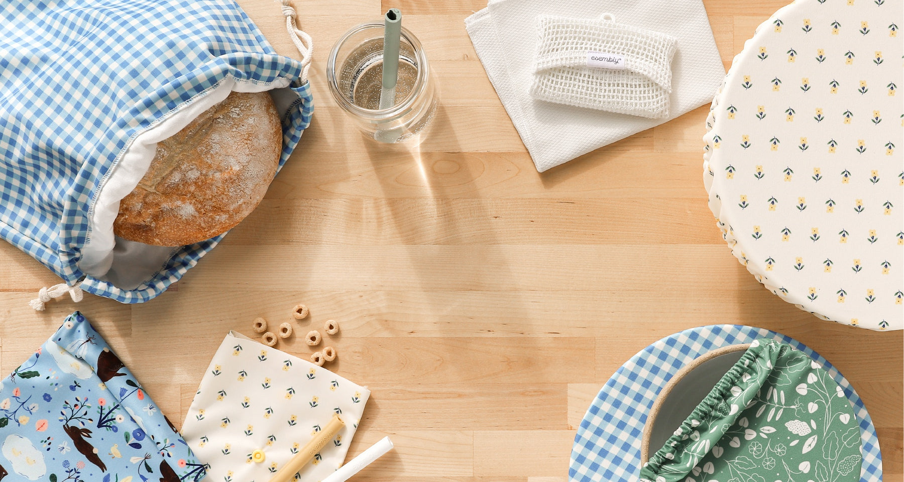 Esembly Home Goods in designs illustrated by Flora Waycott on a butcher block countertop