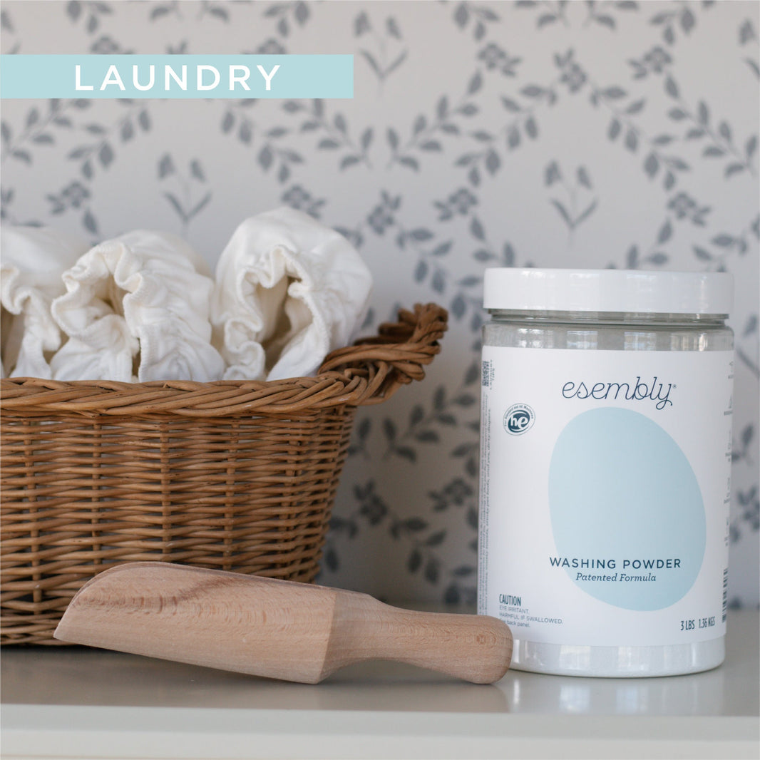 Basket with Cloth DIapers next to Washing Powder
