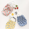 Set of reusable storage bags with fruit patterns on a white background