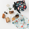 Ditty Bags in Peace + Joy and Santas used as gift wrap for kid's toys
