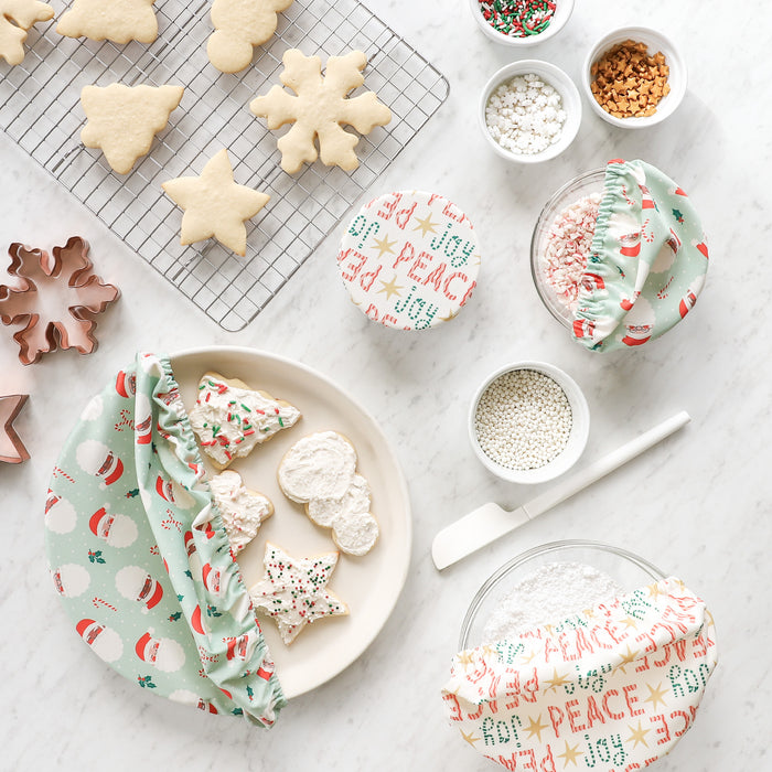 Peace + Joy and Santas Bowl Caps covering cookies and ingredients