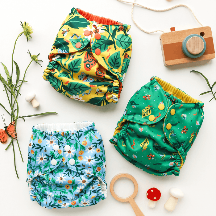 Overhead view of diapers in In The Garden, Dancing Daisies, and Crawlers