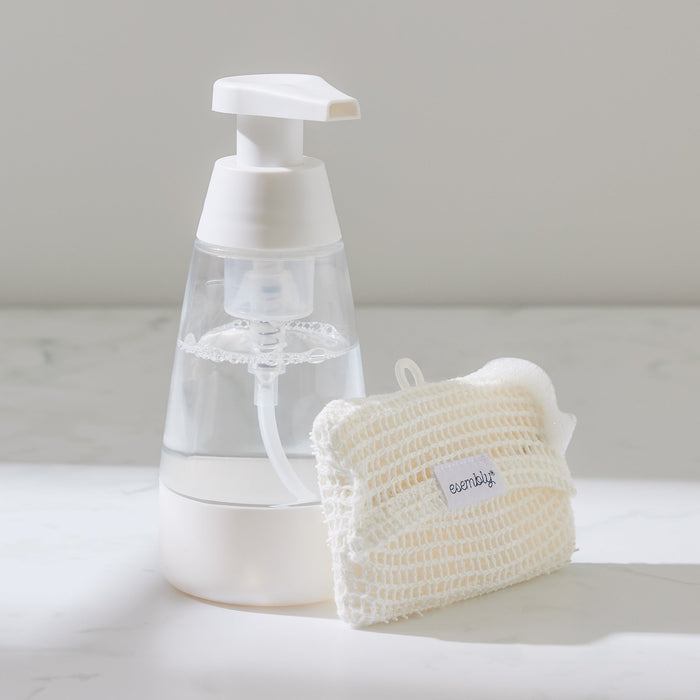 A GoTwo Sudser and Sponge next to a white and clear soap foamer