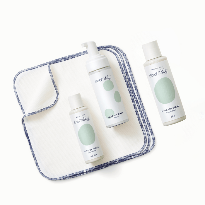 Esembly Wipe Up Wash Concentrate and Foamer on top of Esembly Wipe Ups next to Esembly Wipe Up Wash Concentrate Refill