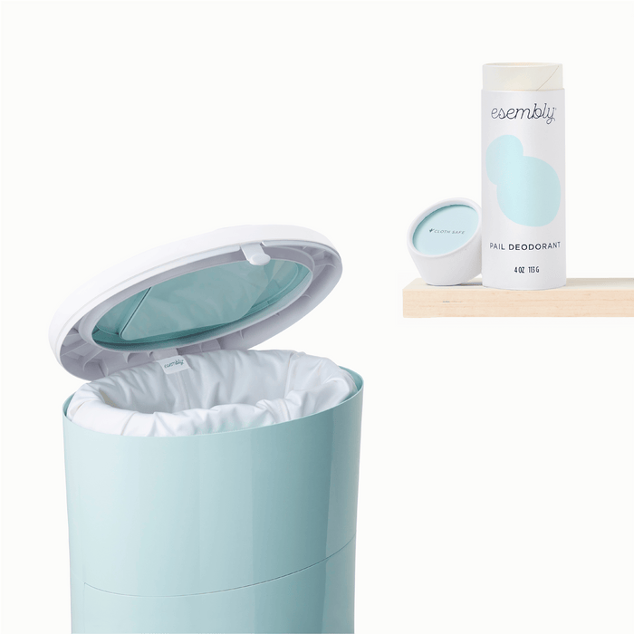Esembly Pail Pouch inside of a light blue Diaper Pail next to Pail Deodorant on a shelf