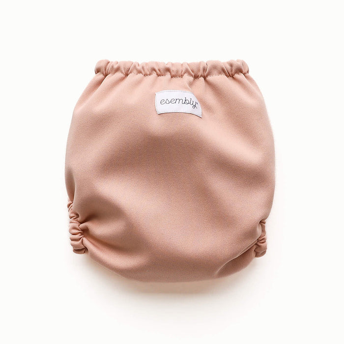 Back view of Esembly Outer in a light pink color