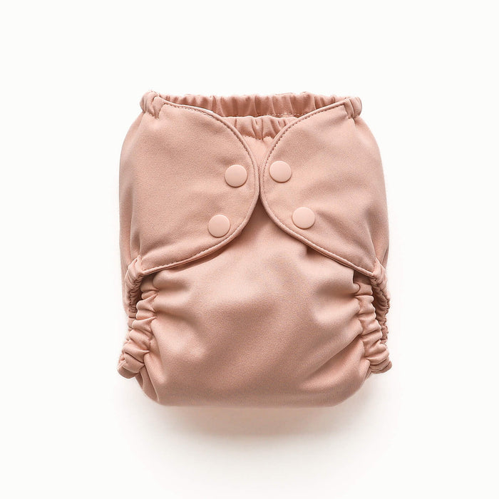 Front view of Esembly Outer in a light pink color