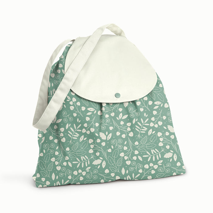 Front View of Botany Day Bag. Front and back is Botany (green background with white leaves) and flap and strap is Parchment (soft white)