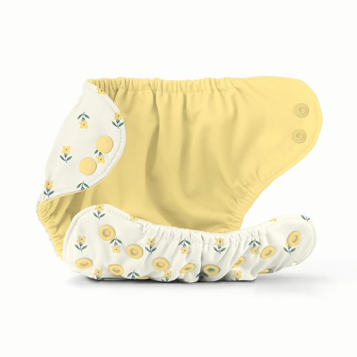 Inside View of an Esembly Outer in Buds - Exterior is Buds (a parchment background with tiny yellow and green flowers) and interior is Buttercup (a buttery yellow solid color)