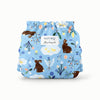 Back View of an Esembly Outer in Bunnies (bunnies, flowers, and ducks illustrated by Flora Waycott on a mid-tone blue background)
