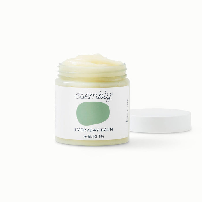 Esembly Everyday Balm jar with a green splotch on the packaging