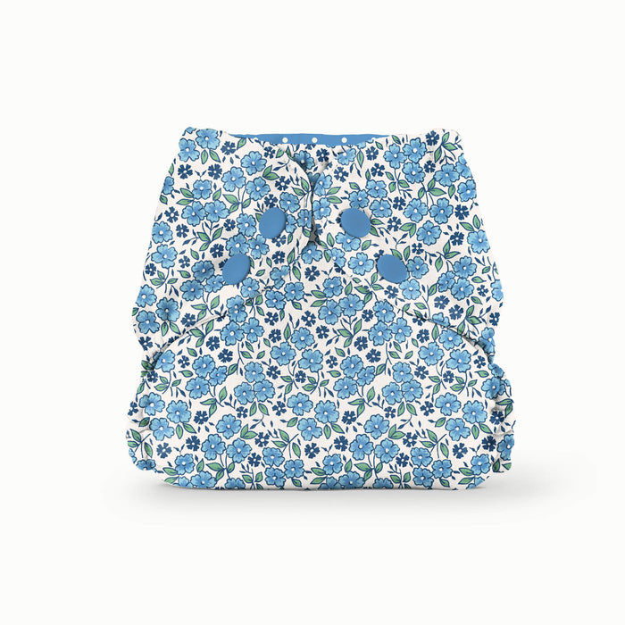 Front view of a blue floral Esembly Outer in Forget-Me-Not