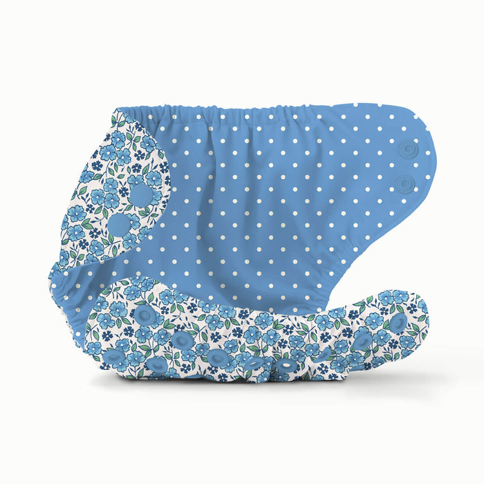 Inside view of a blue floral Esembly Outer with a blue interior with white polkadots