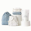 Three Inners, One Ditty Bag in blue floral, one Outer in blue floral, and a bag of washing powder