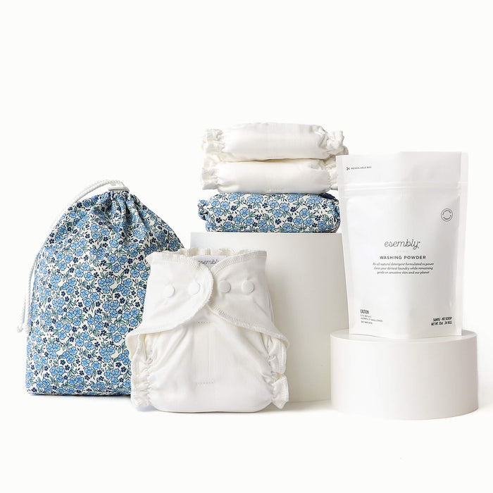 Three Inners, One Ditty Bag in blue floral, one Outer in blue floral, and a bag of washing powder