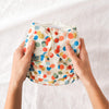 Person holding an Esembly Outer in Funfetti