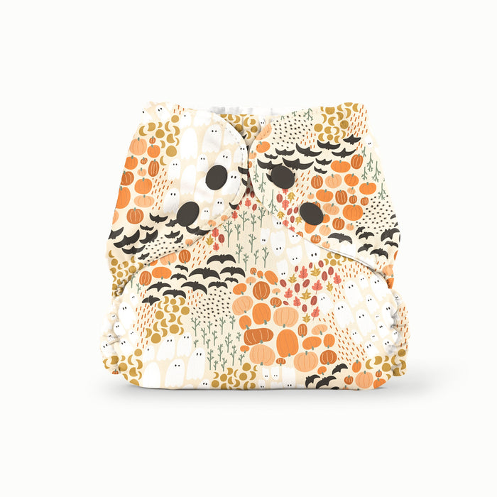 Front view of Esembly's Pumpkin Patch print (light orange background with ghosts, moons, pumpkins, bats, and fall foliage) on an Outer.