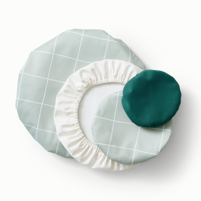 Bowl Caps in lattice (a light green background with white lined grid pattern), off-white, and dark green