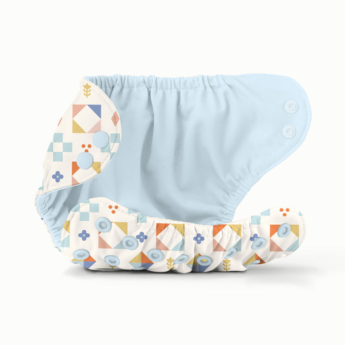 Baby diaper with geometric pattern and a blue interior on a white background
