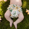 Front view of a baby wearing a Roar! Outer