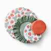 Bowl Caps in Strawberries (a white background with red strawberries and light green leaves), mid-tone green, and reddish brown