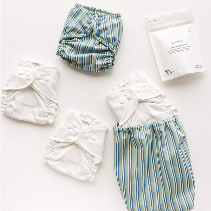 A Try it Kit in Sunday Stripe — blue, green, and white stripes — with Inners and Washing Powder