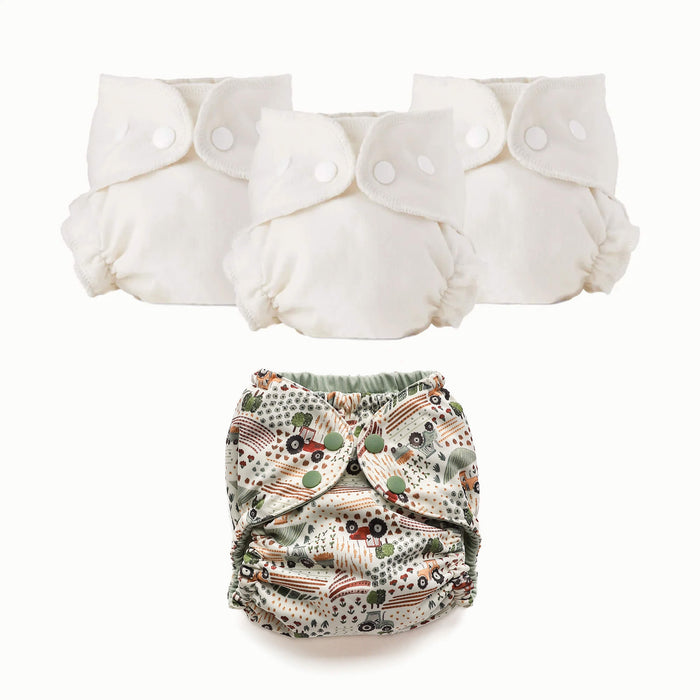 Three off-white reusable cloth diaper covers with snap closures are shown above a single patterned cloth diaper underneath on a clean white background.