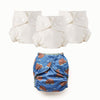 Set of three cloth diapers Inners and one blue with turtle pattern diaper Outer, on a white background.