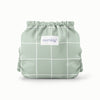 Back view of Esembly Outer a light green background with white lined grid pattern