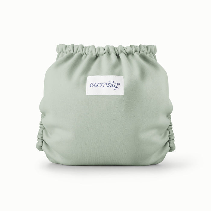 Back view of Esembly Outer in a light mint green color