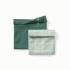 Sandwich size reusable bag in dark green and a snack size reusable bag in Lattice (a light green background with white lined grid pattern)